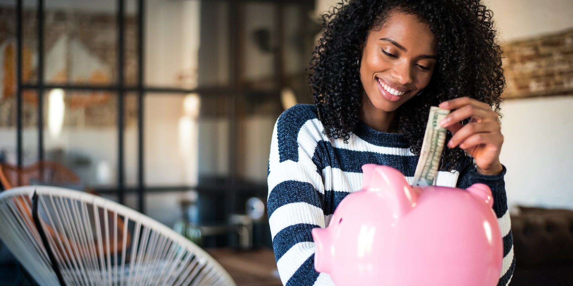 Woman with saving piggy bank