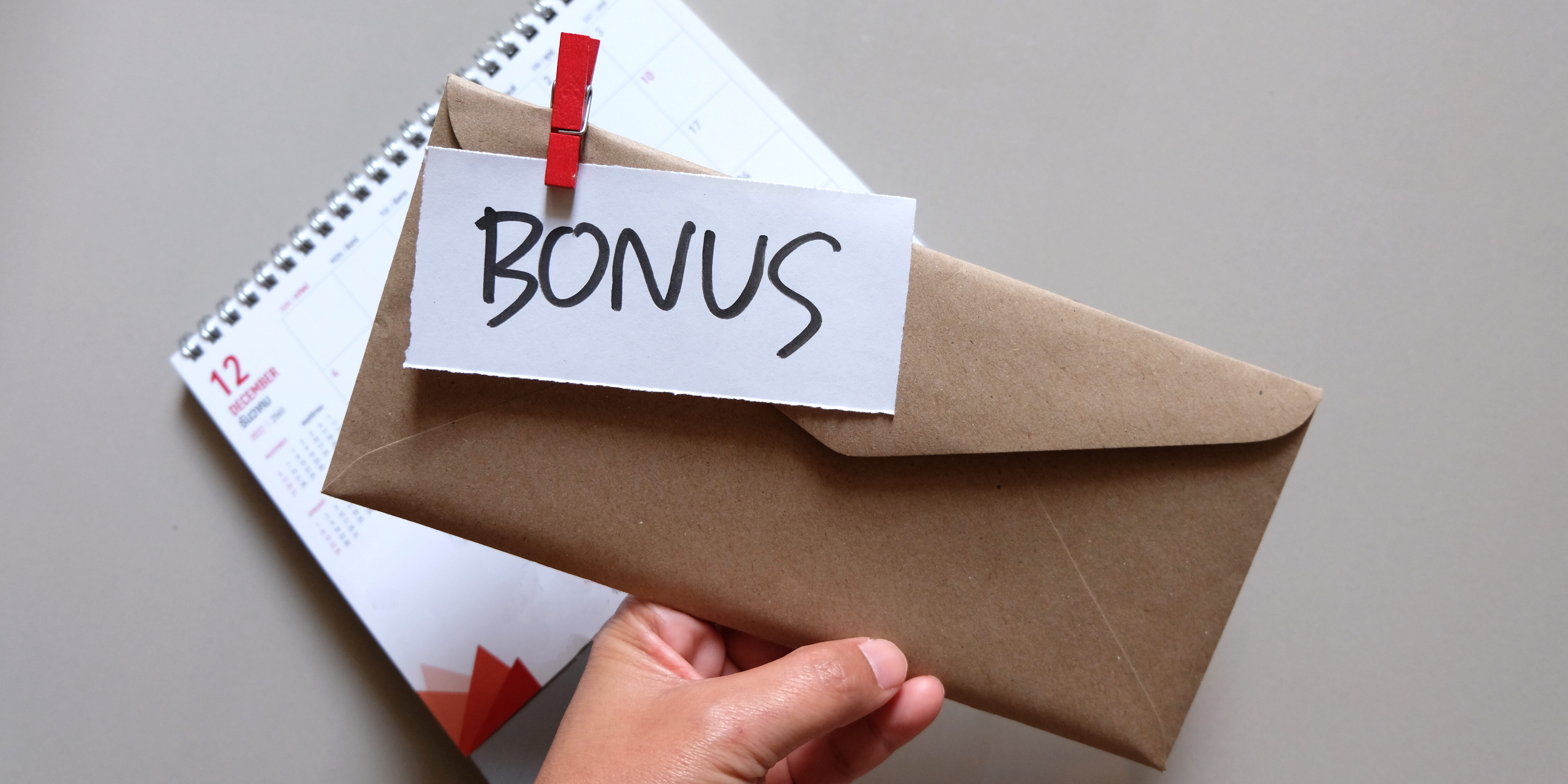 concept of bonus, communication by pulling paper of bonus from the envelope.