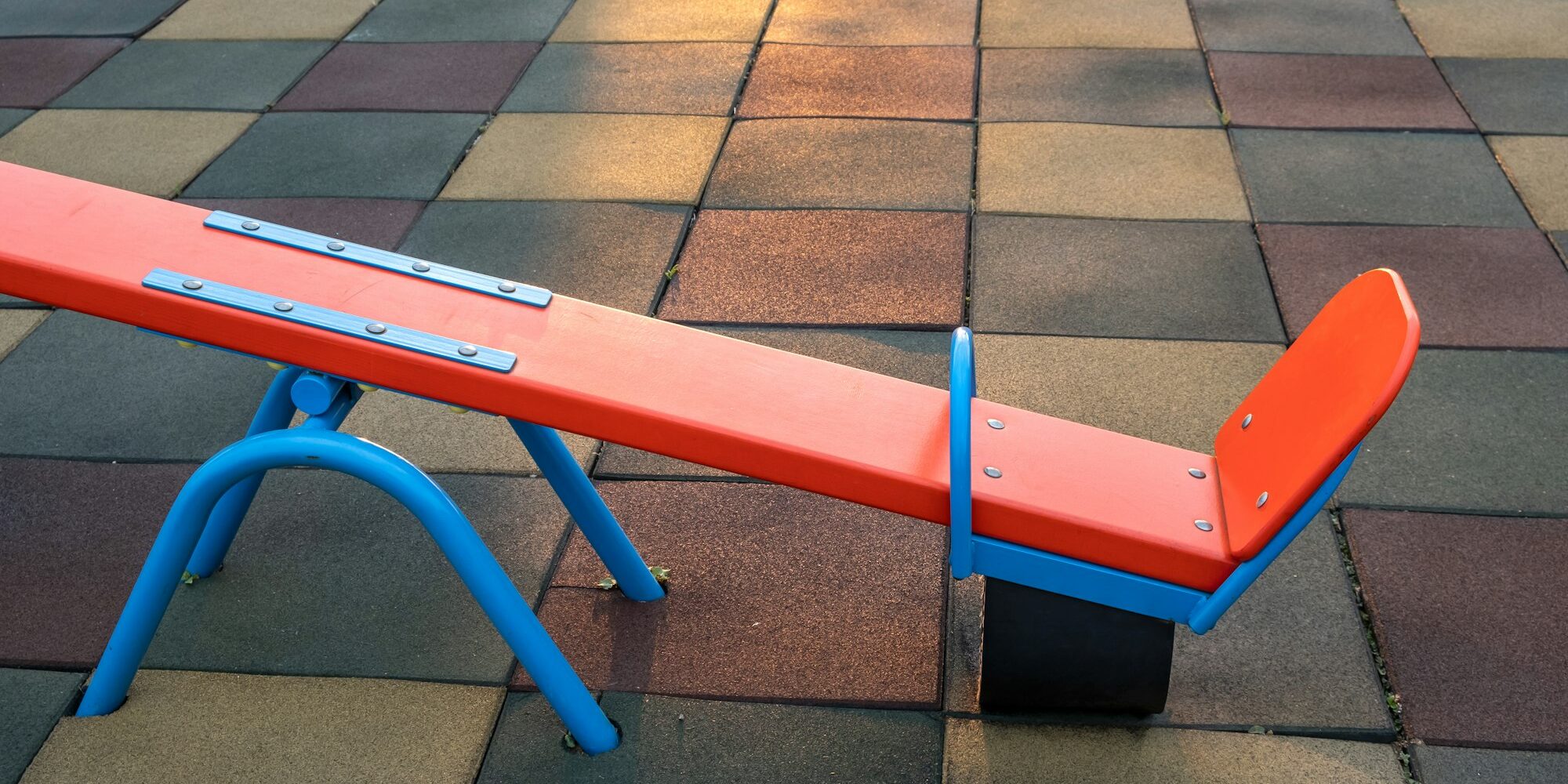 Rubber coating and flip flap swing at the playground at preschool.