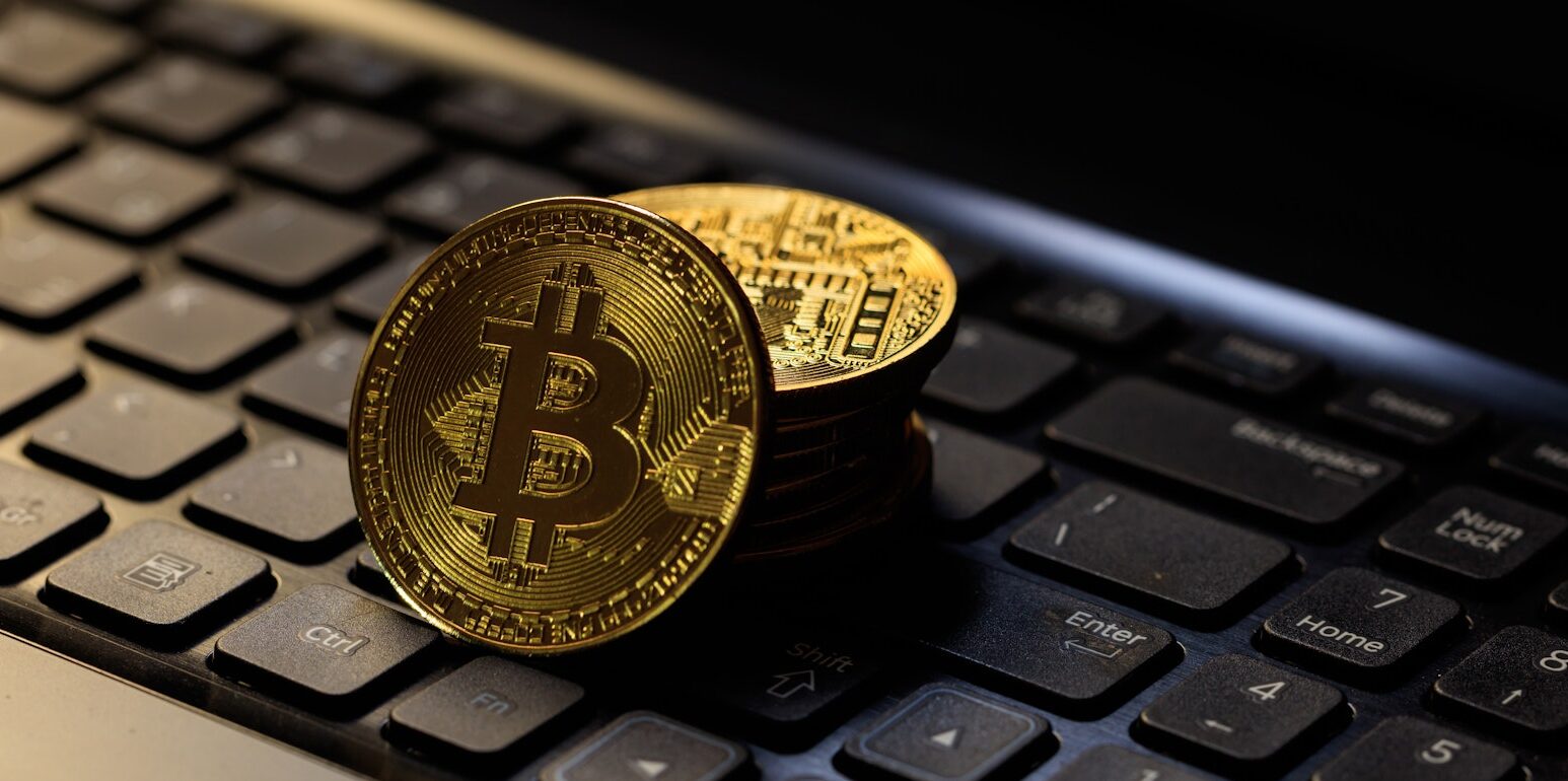 Bitcoins on a black laptop